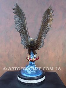 Bronze sculpture of flying eagle with captured salmon on custom marble base