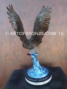 Bronze sculpture of flying eagle with captured salmon on custom marble base