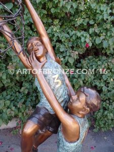 Takin it to the Hoop bronze sculpture of junior basketball players dunking