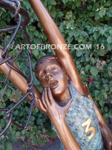 Takin it to the Hoop bronze sculpture of junior basketball players dunking