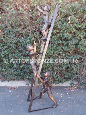 Team Work bronze sculpture of two boys climbing ladder working on house