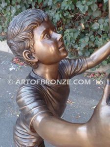 Team Work bronze sculpture of two boys climbing ladder working on house