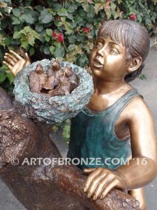 Baby Rescue Bronze Statue of kids playing together rescuing baby birds in tree