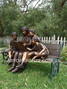 Making a Difference bronze sculpture of four children sitting on bench reading a book