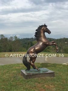 Thunderstorm sculpture of reared horse with forelegs off the ground and hind legs attached bronze base