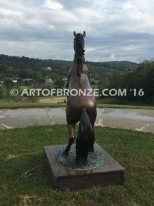 Thunderstorm sculpture of reared horse with forelegs off the ground and hind legs attached bronze base