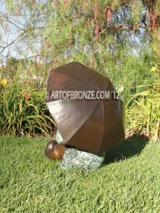 Summer Breeze bronze sculpture of cute young girl in the sun with umbrella