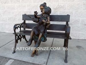 Mom Knows Best Bronze sculpture of little girl sitting on moms lap being read a book