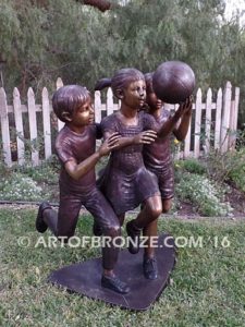 Playing Ball bronze sculpture of girl and two boys juggling ball