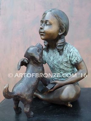 Give me Attention bronze statue girl sitting down playing with puppy dog on her lap