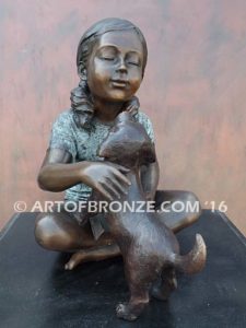 Give me Attention bronze statue girl sitting down playing with puppy dog on her lap