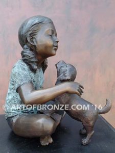 Give me Attention bronze statue girl sitting down playing with puppy dog on her lap