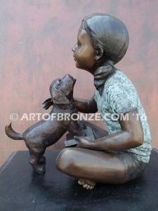 Give me Attention bronze statue girl sitting down playing with puppy dog on her lap