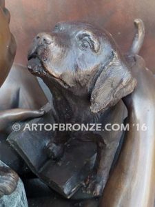 Give me Attention bronze statue girl sitting down playing with puppy dog on her lap