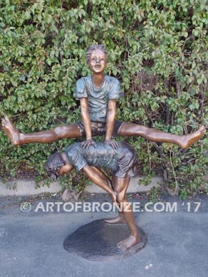 Leapfrog bronze sculpture of two kids playing leapfrog