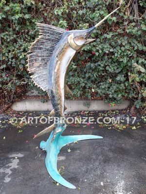 Heroic sculpture of bronze leaping sailfish that can spray water from bill into shopping center fountain