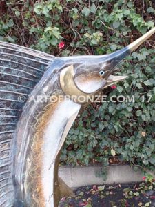 Heroic sculpture of bronze leaping sailfish that can spray water from bill into estate fountain