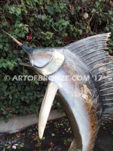 Heroic sculpture of bronze leaping sailfish that can spray water from bill into estate fountain