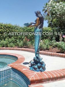 Bronze mermaid sculpture holding oyster shell for pond, pool or aquatic display