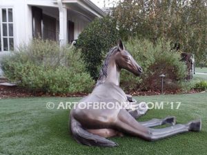 Spring Blessing bronze sculpture of laying foal, filly, colt and yearling horse for ranch or equestrian center