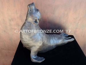 Sunbather bronze sea lion and seal mascot sculpture for zoo, university or school mascot