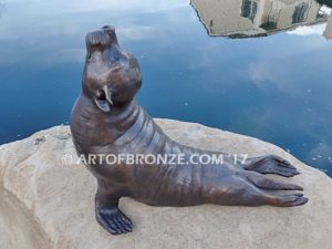 Sunbather bronze sea lion and seal mascot sculpture for zoo, university or school mascot