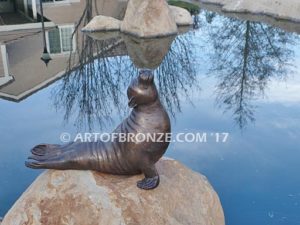 Sunbather bronze sea lion and seal mascot sculpture for zoo, university or school mascot