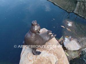 Sunbather bronze sea lion and seal mascot sculpture for zoo, university or school mascot