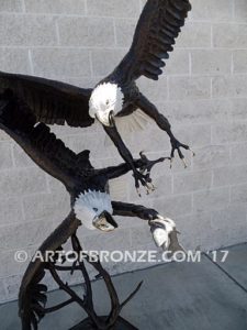 Fish Thieves bronze sculpture of monumental eagles fighting over captured salmon