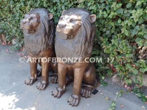 Beauty & Strength high quality cast bronze African lion pair sitting next to each other