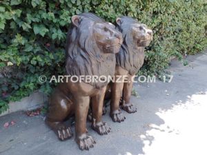 Beauty & Strength high quality cast bronze African lion pair sitting next to each other