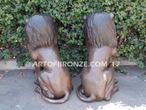 Beauty & Strength high quality cast bronze African lion pair sitting next to each other