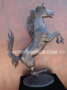 Legendary Spirit sculpture of reared horse on one leg attached to a marble base