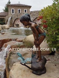 Pond Fun bronze sculpture of young girl in bathing suit playing with bullfrog