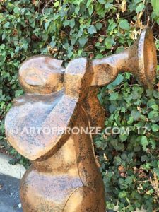 Stylized trumpet player outdoor modern bronze statue