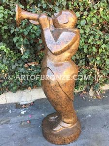 Stylized trumpet player outdoor modern bronze statue