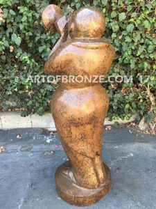 Stylized trumpet player outdoor modern bronze statue