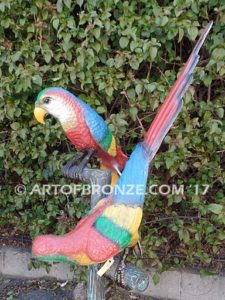 Double Talk statue of two macaws on a branch together