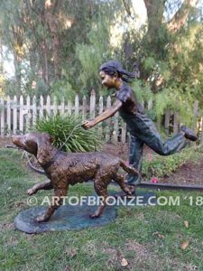 Friends for Life bronze sculpture of girl playing and running with her pet dog