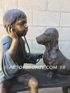 Future Vet bronze sculpture of veterinarian boy with stethoscope and dog on bench