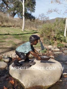 Junior Sailor bronze sculpture of young boy with sailboat in his hands