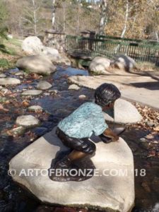 Junior Sailor bronze sculpture of young boy with sailboat in his hands