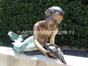 Bronze mermaid sculpture holding oyster shell for pond, pool or aquatic display