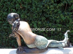 Bronze mermaid sculpture holding oyster shell for pond, pool or aquatic display