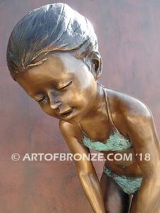 Pond Fun bronze sculpture of young girl in bathing suit playing with bullfrog