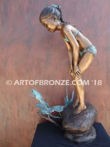 Pond Fun bronze sculpture of young girl in bathing suit playing with bullfrog