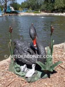 Black Swan outdoor life-size statue of swan and playing cygnets