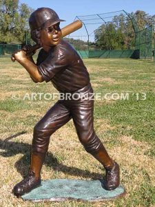 Championship Game bronze baseball player statues featuring a boy pitching and hitting