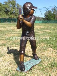 Championship Game bronze baseball player statues featuring a boy pitching and hitting