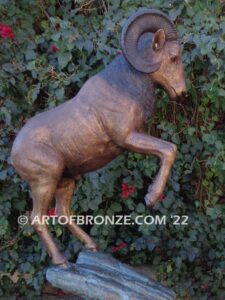 Crashing Titan monumental indoor/outdoor reared up big horn sheep attached to bronze rock ledge